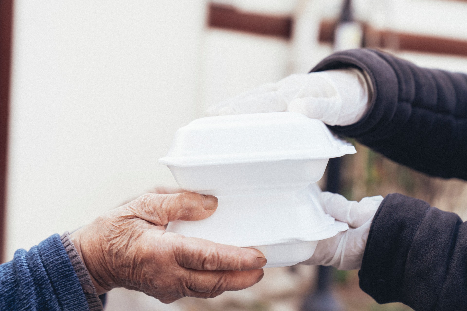 Close up of woman receiving take away food delivery